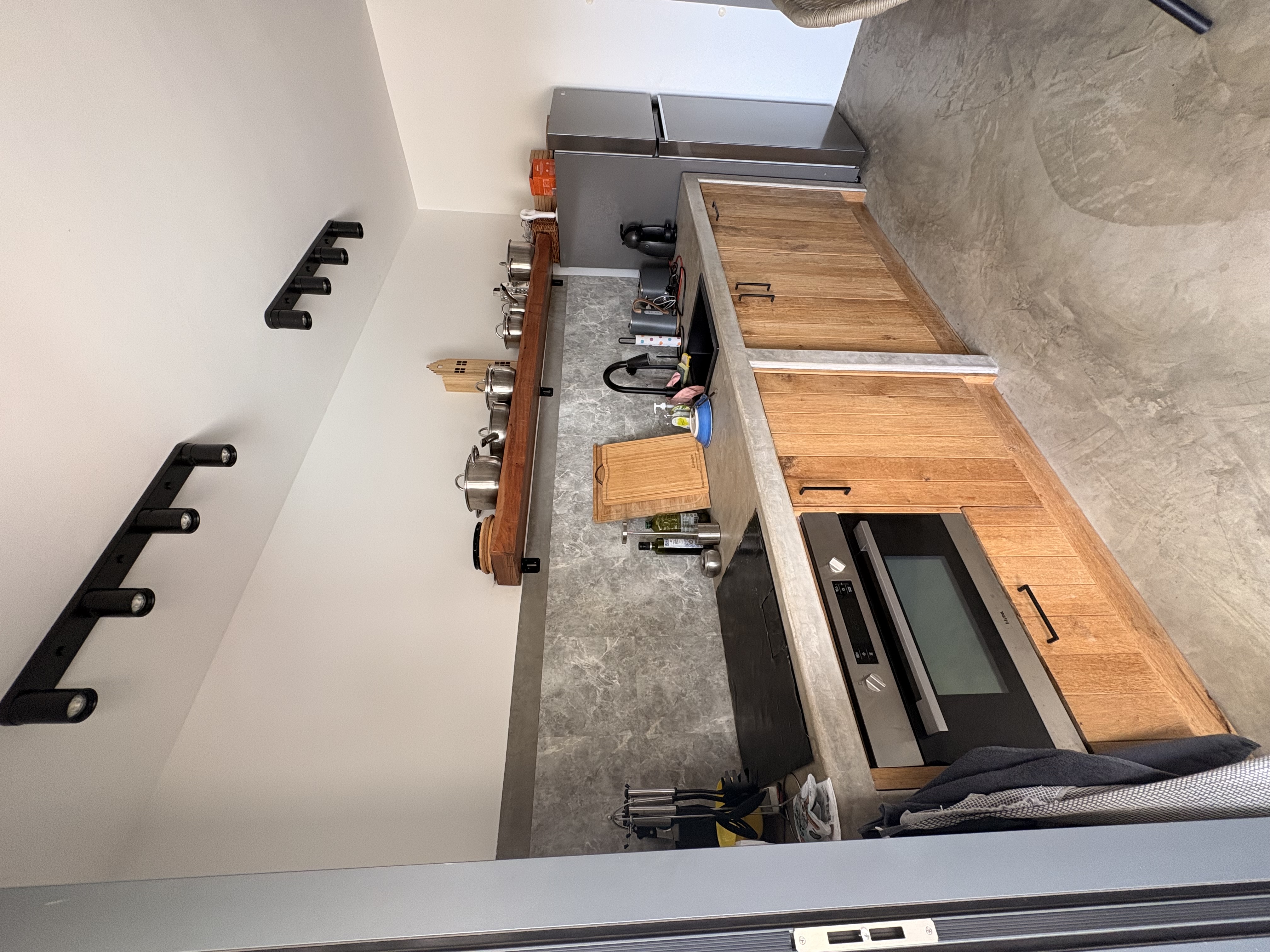 Kitchen with teak cabinets and oven