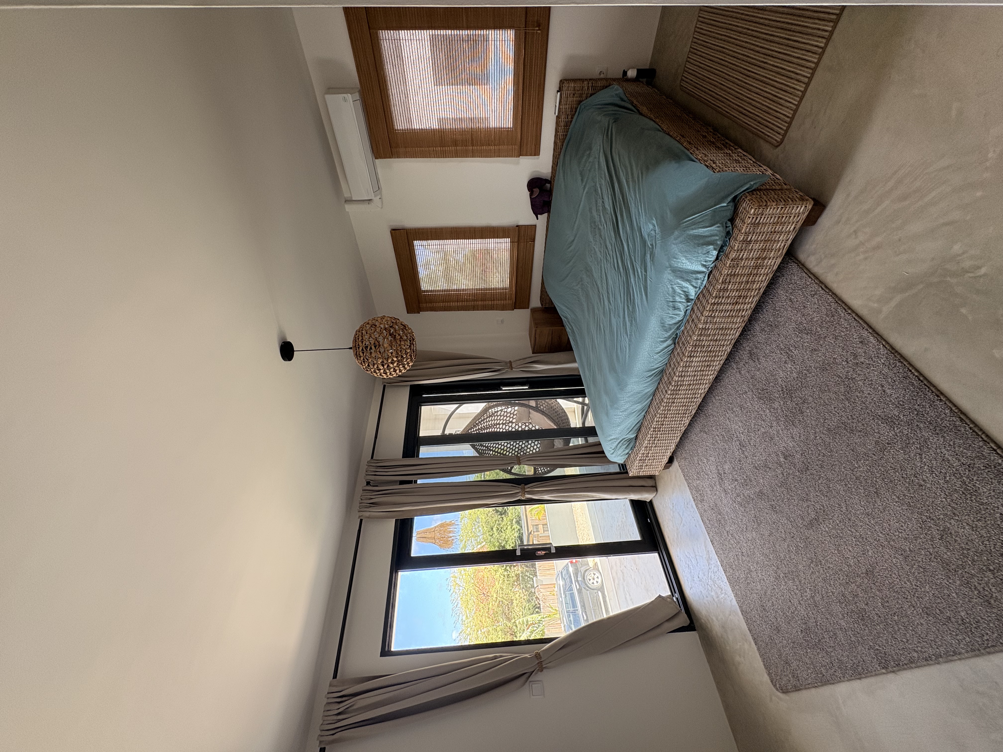 Master bedroom with balcony view